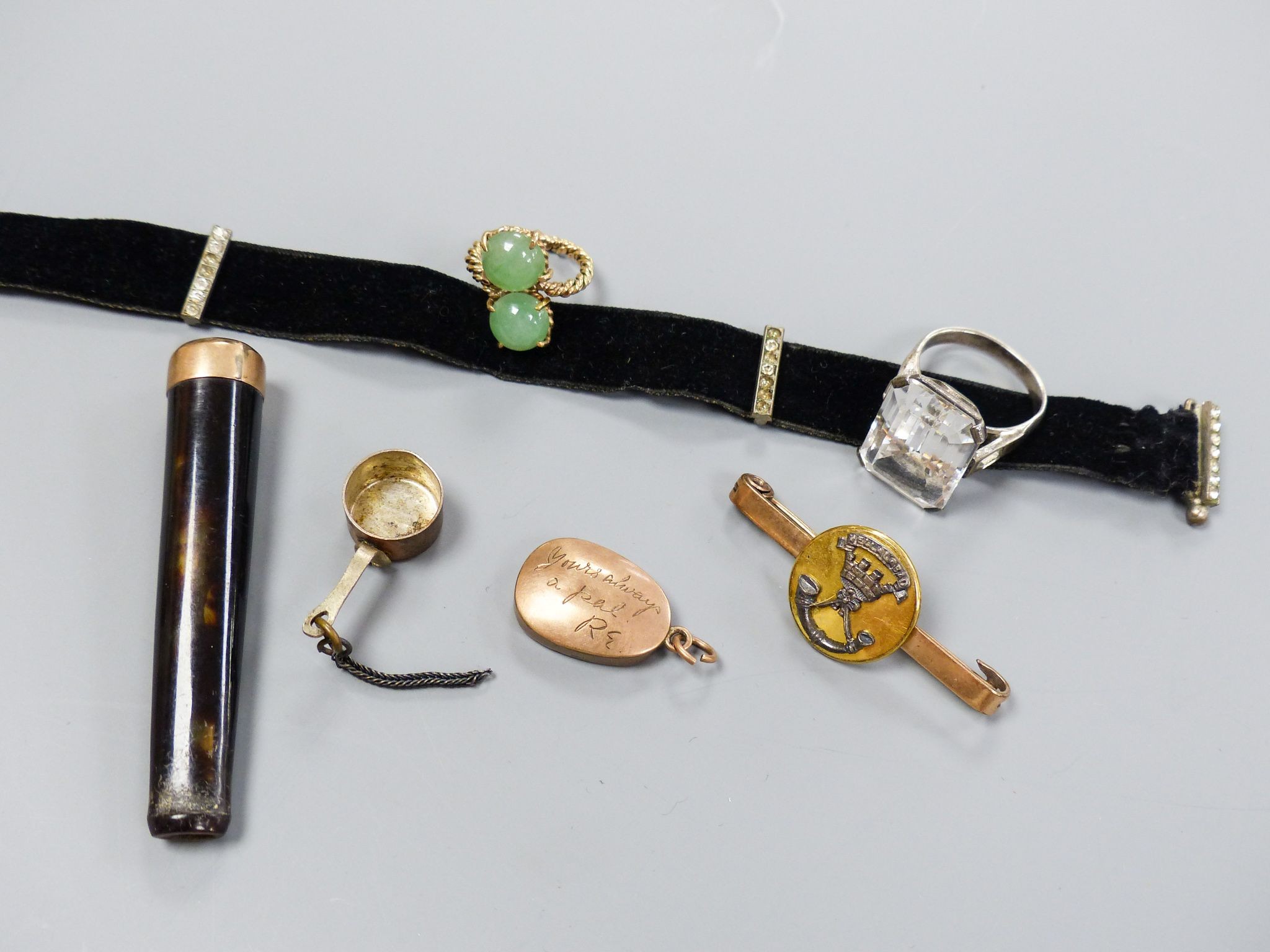 Minor jewellery including a white metal and white paste set dress ring, one other two stone ring, a bar brooch etc.